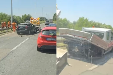 HAOS NA PANČEVAČKOM PUTU: Automobil se zakucao u znak i oštetio vozilo radnika na kolovozu (VIDEO)